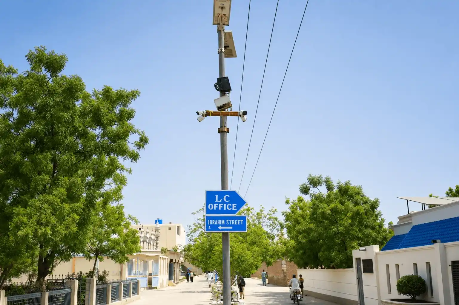 Shahrah-e-Umar main boulevard with paved road and street lights in Luhur Colony, Larkana